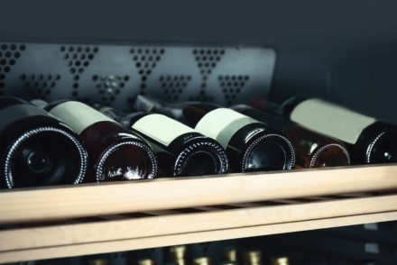 Wine bottles cooling in refrigerator
