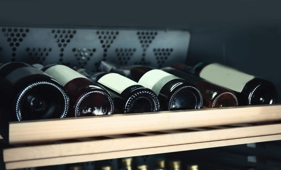 Wine bottles cooling in refrigerator